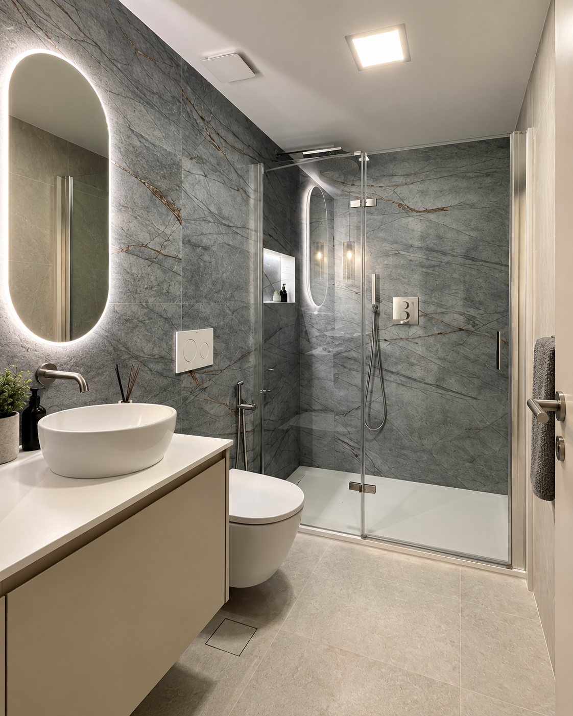 Baño reformado en Valencia con acabados de piedra gris